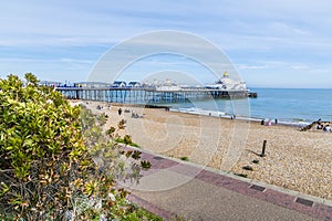 A view from the upper promenade looking towards the pier at Eastbourne, UK