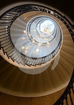 View upward  spiral staircase with beautiful light