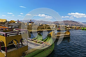 View of Uros floating islands with typical boats, Puno, Peru photo