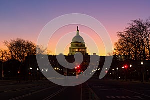 A view on US Capitol from Pennsylvania avenue at dawn in Washington DC, USA.