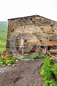 View of the Ushguli village at the foot of Mt. Shkhara. Lamaria Monastery, Rock tower towers and old houses in Ushguli