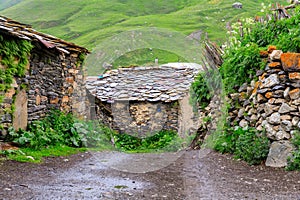 View of the Ushguli village at the foot of Mt. Shkhara. Lamaria Monastery, Rock tower towers and old houses in Ushguli