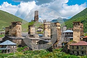 View of the Ushguli village at the foot of Mt. Shkhara. Picturesque and gorgeous scene. Rock towers and old houses in Ushguli,