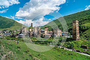 View of the Ushguli village at the foot of Mt. Shkhara. Picturesque and gorgeous scene. Rock towers and old houses in Ushguli,