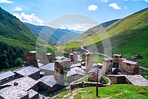 View of the Ushguli village at the foot of Mt. Shkhara. Picturesque and gorgeous scene. Rock towers and old houses in Ushguli,