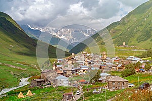 View of the Ushguli village at the foot of Mt. Shkhara. Picturesque and gorgeous scene. Rock towers and old houses in Ushguli,