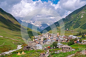 View of the Ushguli village at the foot of Mt. Shkhara. Picturesque and gorgeous scene. Rock towers and old houses in Ushguli,