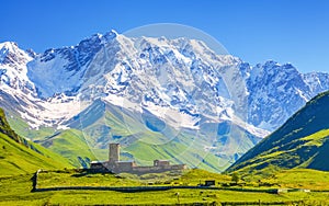 View on Ushguli village at the foot of snow-capped Mt. Shkhara.