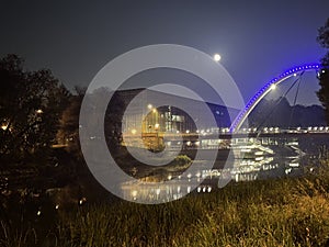 View of the Vabadussild bridge over the river EmajÃµgi during full moon night, Tartu, Tartumaa, Estonia, September 2023 photo