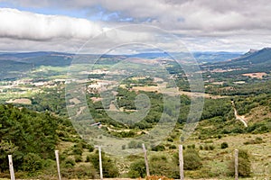 View of the Valderredible Valley with cloudy skies from the La Lora viewpoint. Cantabria, Spain photo