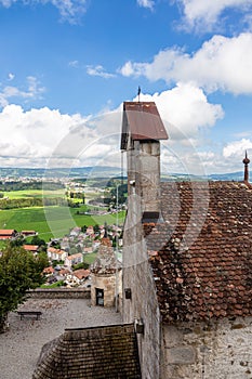 View of the valley, alpine mountains and cloudy sky from Castle Gruyeres, Switzerland