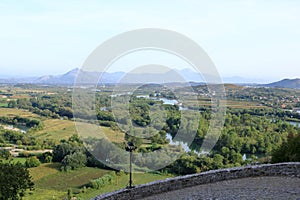 View of a valley with a rural settlement from the ancient stone wall of Rozafa Castle in Shkoder, Albania