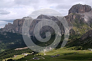 View of a valley and Sella mountain range with Boe peak in Canazei, Italy