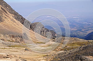 View of valley and smog from volcan Popocatepetl eruption from volcan Iztaccihuatl photo