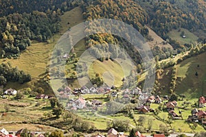 View of the valley with the villages at the foot of the Carpathian Mountains not far from the city of Bran in Romania