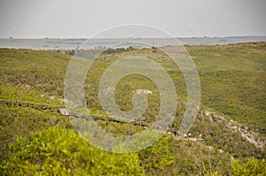 View of the valley a wooden walkway in the Quebrada de los Cuervos NP from a lookout high up