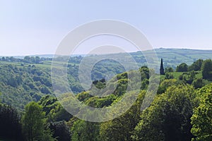 View of the valley and woodland looking over hardcastle crags with war memorial in calderdale west yorkshire