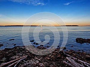 View from Vancouver Island, Canada, with sailboats cruising the