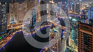 View of various skyscrapers in tallest recidential block in Dubai Marina aerial day to night timelapse