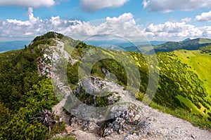 View of the vast mountains in Mala Fatra National Park, Slovakia, on a hot day of summer with cloudy sky. Summer hiking