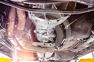 View of vehicle undercarriage on a lift.