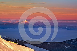 View of Velky Choc mountain from Chopok during winter sunrise