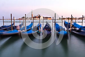 View of Venetian gondolas during sunset.