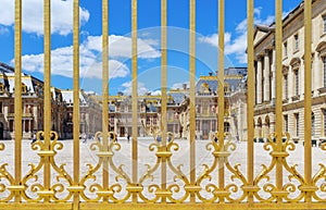 View of Versailles Palace courtyard throught the palace gate - France