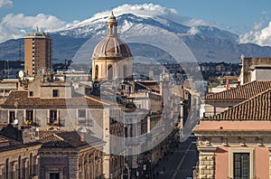 View on via Etnea in Catania. Dome of Catania and the main street with the background of volcano Etna