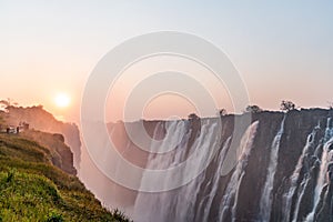 View on the victoria falls from zambia in high water season wit ablue sky in africa