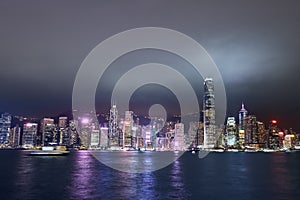 View of Victoria Harbor and Hong Kong at night. Urban landscape