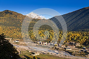 View of the village in a beautiful autumn landscape with white clouds in Svaneti. Georgia