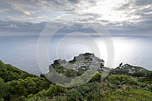 View on the village of FajÃÂ£ do Ouvidor, a permanent debris field, built from the collapsing cliffs on the northern coast of the photo