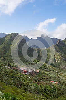 View of the village of Las Portelas and the mountains on the road