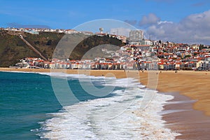 View over the beach and village of NazarÃ©, Portugal photo