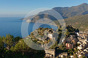 View of  the village of Nonza with its Genoese tower, Cap Corse in Corsica France