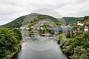 View of the village of Os Peares, Ourense, Galicia in Spain, where the Sil and Mino rivers converge photo