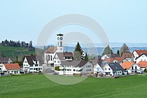 View of the village Schoenenberg, Switzerland, with surrounding fields and hills