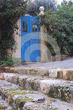 View of vintage blue gate Zichron Yaakov Israel