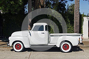 A view of a vintage classic car van in the street