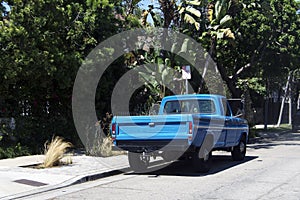 A view of a vintage classic car van in the street