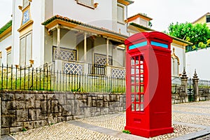 View on vintage red phone booth in Sintra, Portugal