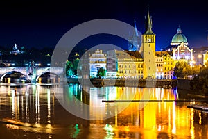 View of the Vltava river and Charles Bridge at dusk. Prague, Czech Republic