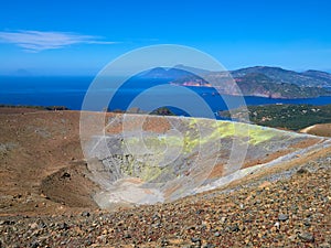 View of the volcanic crater and Lipari and Salina islands from the top of the volcano of the Vulcano island in the Aeolian islands