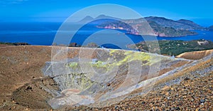 View of the volcanic crater and Lipari and Salina islands from the top of the volcano of the Vulcano island in the Aeolian islands