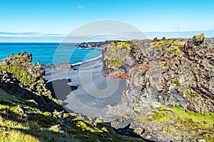 View at Volcanic lava formations of Djupalonssandur beach in north direction