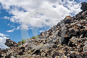 View of volcanic lava rocks and blue sky on Lanzarote island