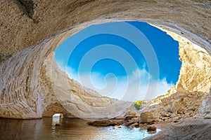 View of the volcanic open cave of Sykia, Milos island, Cyclades, Greece