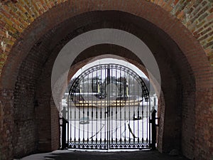 View of the Volkhov River through the arch in the wall of the Novgorod Kremlin.