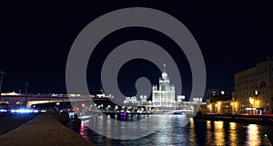 View of the Vysotka on Kotelnicheskaya Embankment and Moscow River in the evening.